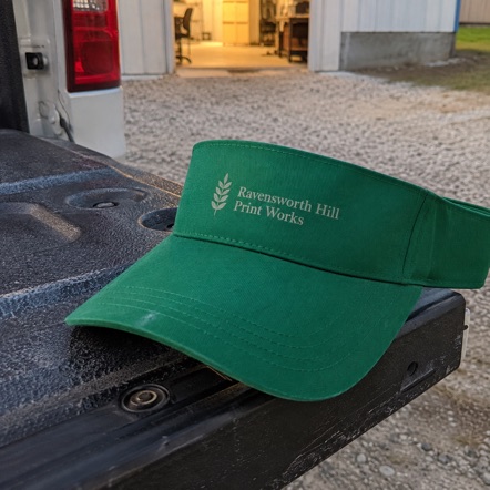 Custom sun visor decorated with a company logo, ready for bulk order